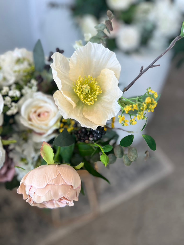 Upclose visual of blush garden style silk flowers