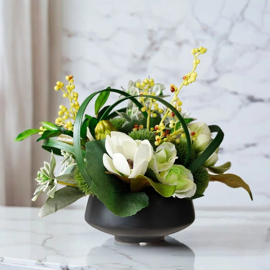 Black vase designed with modern white and green silk flowers for a modern style